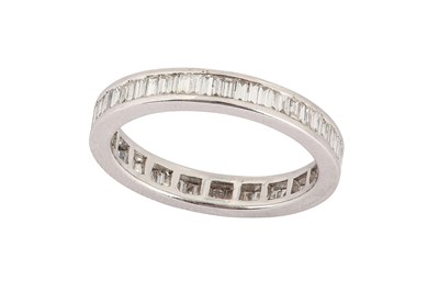 Lot 55 - A diamond eternity ring Channel-set with a...