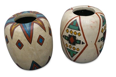 Lot 483 - Two decorative African painted wooden vases...