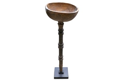 Lot 487 - An antique African cup, raised on turned...