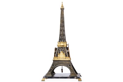 Lot 90 - A GIILT AND PATINATED BRONZE NOVELTY EIFFEL...