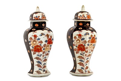 Lot 14 - AN UNUSUAL PAIR OF IMARI VASES AND COVERS....