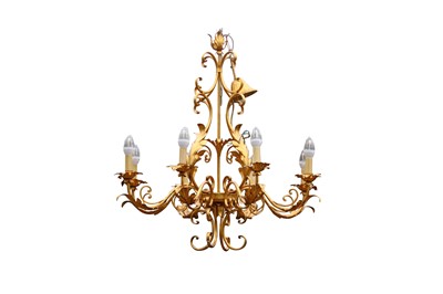 Lot 741 - A gilt metal eight branch chandelier formed of...