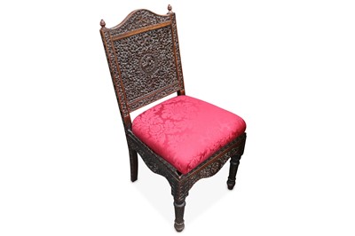 Lot 749 - An ornately carved Anglo Indian side chair,...