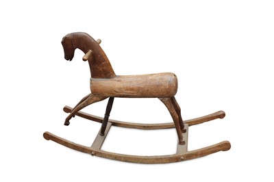 Lot 694 - A rustic rocking horse of crude but charming...