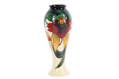Lot 26 - Moorcroft Pottery - A tall baluster form vase...