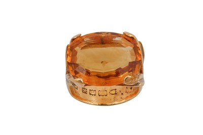 Lot 240 - A citrine ring and earrings The oval-cut...