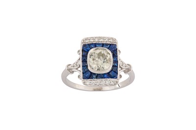 Lot 60 - A sapphire and diamond dress ring Centrally...