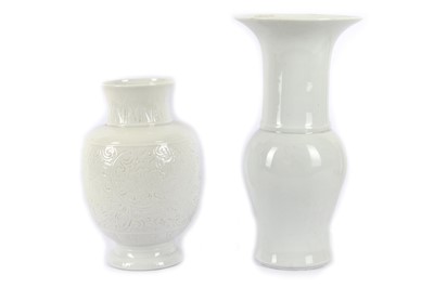 Lot 1032 - TWO CHINESE WHITE-GLAZED VASES. Late Qing...