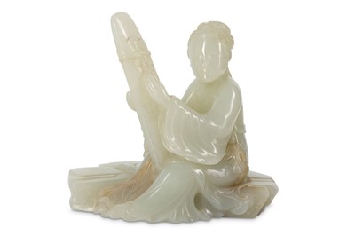 Lot 902 - A CHINESE PALE CELADON JADE CARVING OF A LADY...