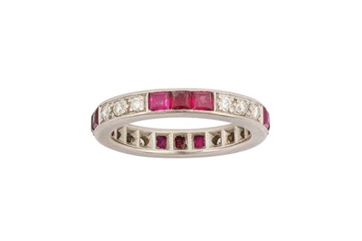 Lot 167 - A ruby and diamond eternity ring The trios of...