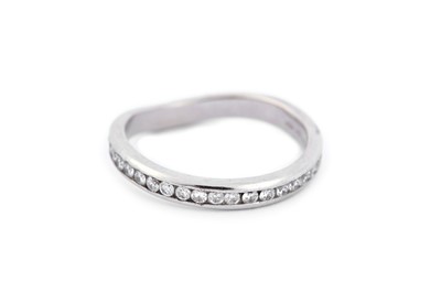 Lot 307 - A diamond-set platinum eternity ring, with...