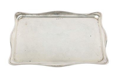 Lot 134 - A George V sterling silver dressing table tray,...