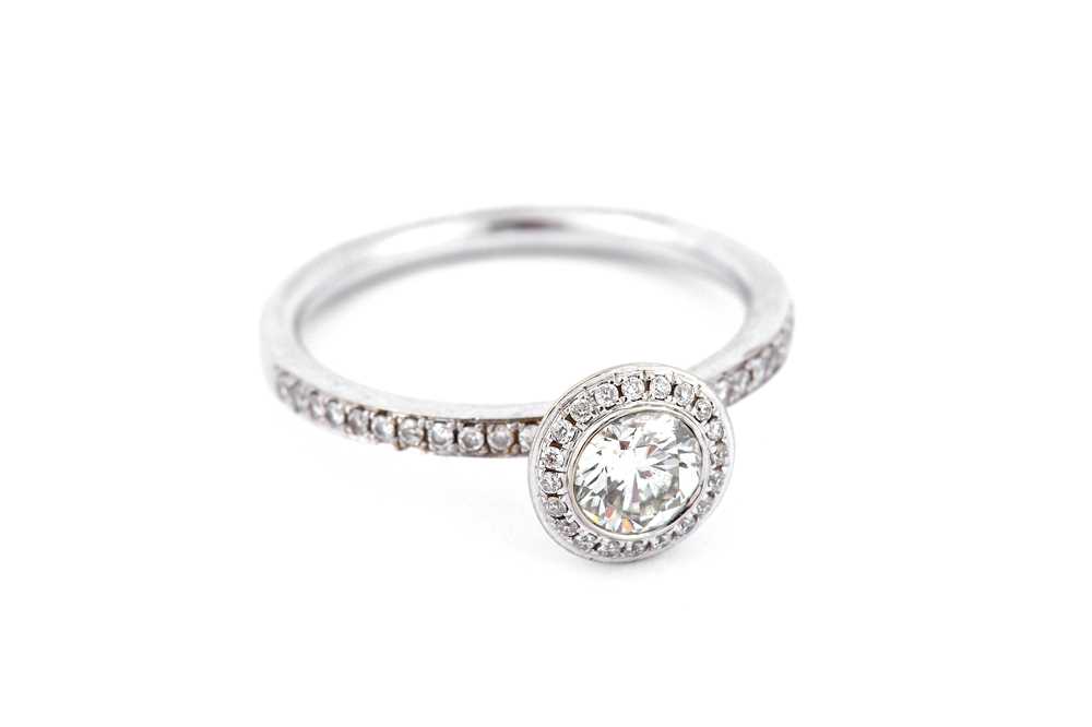 Lot 283 - A diamond ring, Centrally collet-set with a