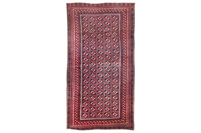 Lot 20 - AN ANTIQUE BALOUCH RUG, NORTH-EAST PERSIA...