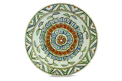 Lot 182 - AN IZNIK POTTERY DISH WITH FLORAL DESIGN...