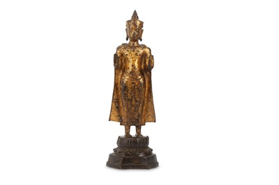 Lot 970 - A THAI GILT-BRONZE FIGURE OF BUDDHA. Thailand,...