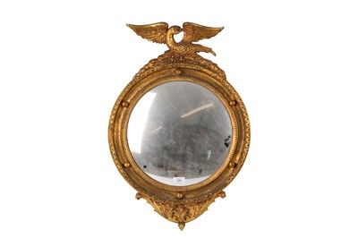 Lot 226 - A Regency style gilt convex mirror with a...