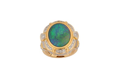 Lot 127 - An opal and diamond dress ring The oval opal,...