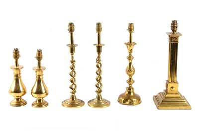 Lot 392 - A collection of six brass table lamps,...