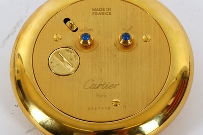 Lot 657 - CARTIER. A PLATED QUARTZ ALARM CLOCK Movement:...