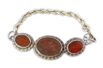 Lot 226 - *A CARNELIAN-ENCRUSTED SILVER BAZUBAND...