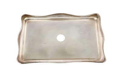Lot 133 - A George V sterling silver dressing table tray,...