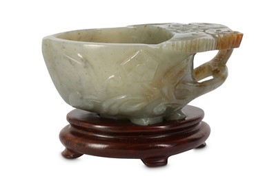 Lot 913 - A CHINESE GREY JADE CUP. The peach-shape body...