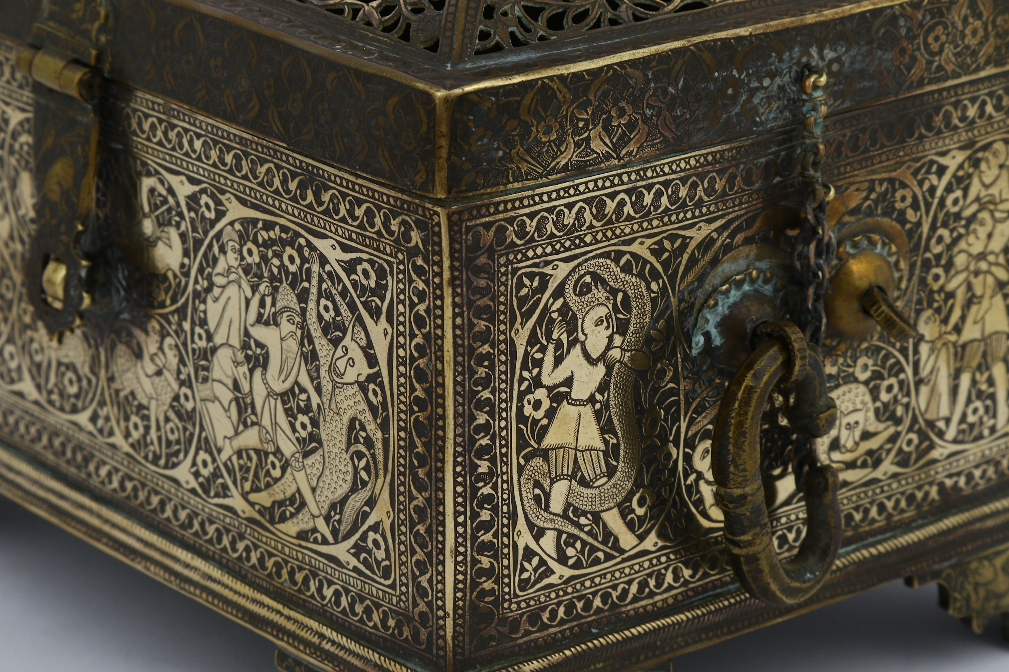 Lot 138 - AN ENGRAVED AND PIERCED BRASS CASKET