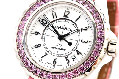 Lot 387 - CHANEL. A LADIES CERAMIC AND STAINLESS...
