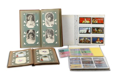 Lot 199 - Two postcard and Christmas card albums dating...