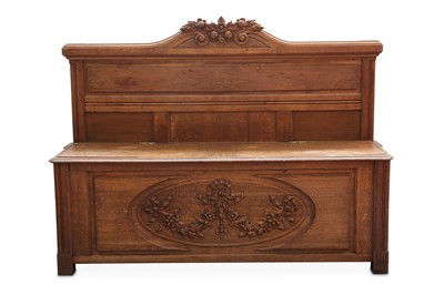 Lot 326 - A French carved oak church pew, the foliate...