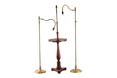 Lot 396 - Two brass rise and fall standard lamps with...