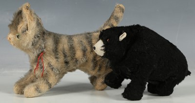 Lot 199 - Steiff cat with tiger stripes, 15cm, and an...