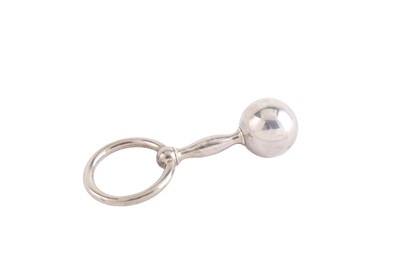 Lot 105 - A modern sterling silver rattle and teething...