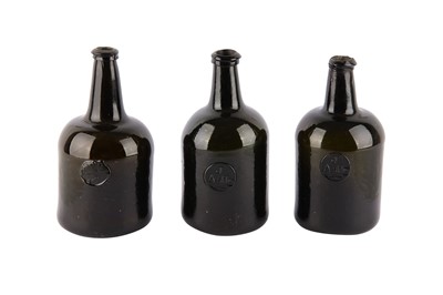 Lot 68 - Three 18th Century English wine bottles, dark...