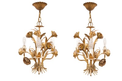 Lot 294 - A pair of gilt metal chandeliers, each three...