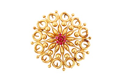 Lot 129a - A ruby brooch, of openwork design, centred by...