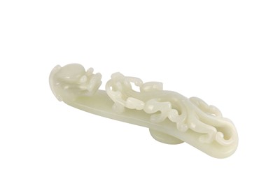 Lot 293 - A Chinese jade carved dragon belt hook, carved...