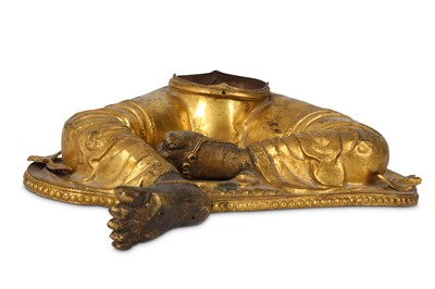 Lot 969 - A TIBETAN GILT-BRONZE FRAGMENT OF A BUDDHIST...