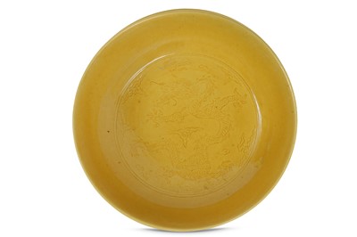 Lot 145 - A CHINESE YELLOW-GROUND 'DRAGON' DISH. Qing...