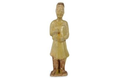 Lot 685 - A CHINESE YELLOW-GLAZED POTTERY FIGURE OF A...