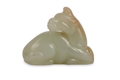 Lot 719 - A CHINESE PALE CELADON JADE ‘UNICORN’ CARVING....