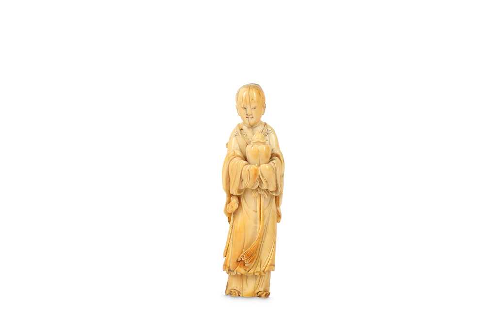 Lot 694 - A CHINESE IVORY CARVING OF A BOY. 17th Century....