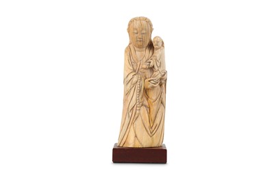 Lot 695 - A CHINESE IVORY CARVING OF A MOTHER AND...