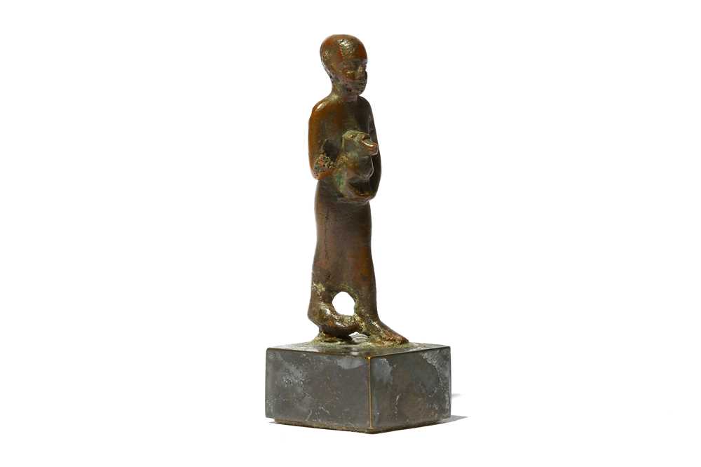 Lot 64 - AN EGYPTIAN BRONZE FIGURE OF A PRIEST Late...