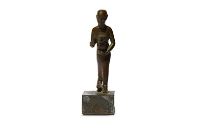 Lot 64 - AN EGYPTIAN BRONZE FIGURE OF A PRIEST Late...