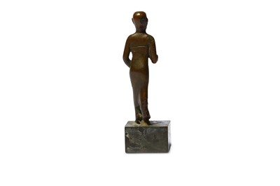 Lot 64 - AN EGYPTIAN BRONZE FIGURE OF A PRIEST Late...