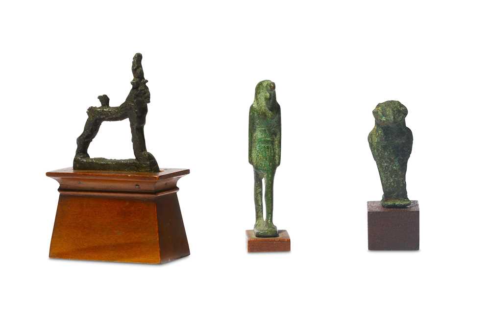 Lot 32 - A GROUP OF EGYPTIAN BRONZE FIGURES Late Period,...