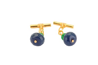 Lot 347 - A pair of sapphire and emerald cufflinks, the...