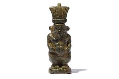 Lot 65 - AN EGYPTIAN SERPENTINE FIGURE OF BES Late...